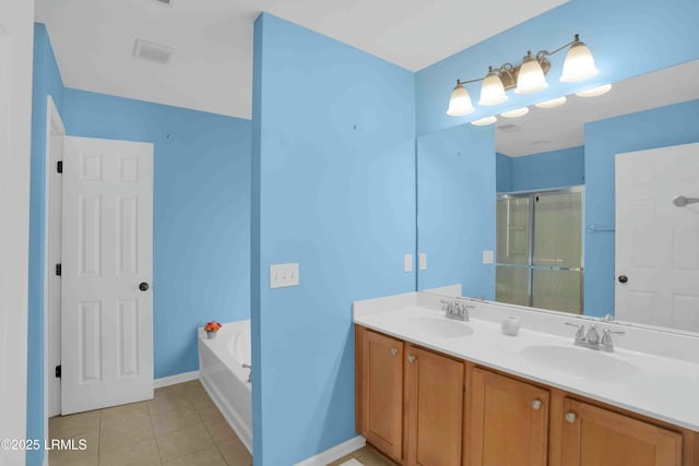 2176 Blakers Blvd, Okatie, SC 29909 - bathroom with double vanity, a stall shower, tile patterned flooring, and a sink