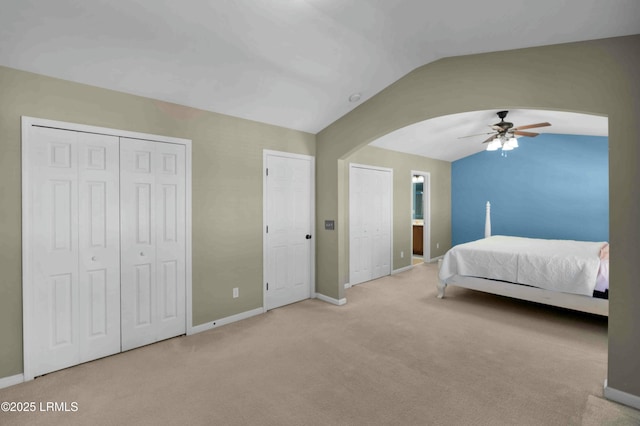 2176 Blakers Blvd, Okatie, SC 29909 - bedroom featuring lofted ceiling, baseboards, arched walkways, and multiple closets