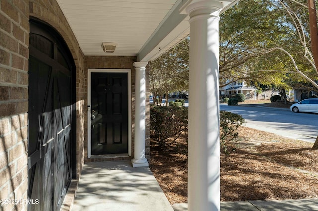 doorway to property featuring a porch