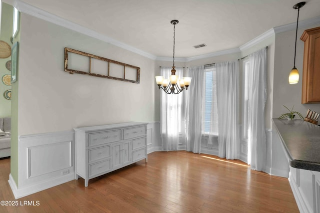 2176 Blakers Blvd, Okatie, SC 29909 - dining area with a chandelier, ornamental molding, wood finished floors, and visible vents