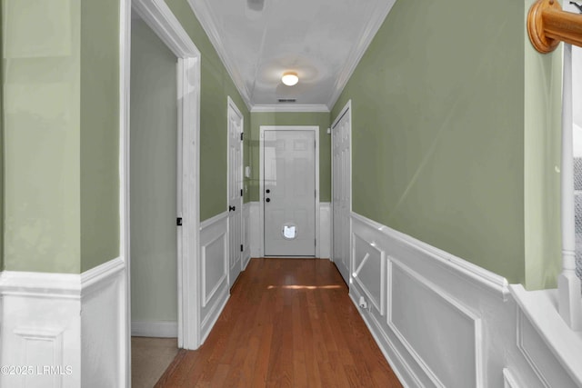 2176 Blakers Blvd, Okatie, SC 29909 - doorway to outside featuring a decorative wall, visible vents, ornamental molding, wainscoting, and dark wood finished floors