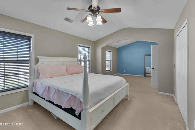2176 Blakers Blvd, Okatie, SC 29909 - bedroom featuring lofted ceiling, arched walkways, light carpet, visible vents, and baseboards
