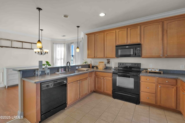 2176 Blakers Blvd, Okatie, SC 29909 - kitchen with a peninsula, a sink, hanging light fixtures, black appliances, and crown molding
