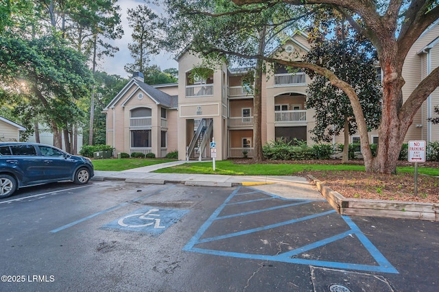 380 Marshland Rd Unit E26, Hilton Head Island, SC 29926 - view of property featuring uncovered parking