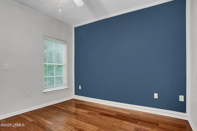 380 Marshland Rd Unit E26, Hilton Head Island, SC 29926 - unfurnished room with wood finished floors and ceiling fan