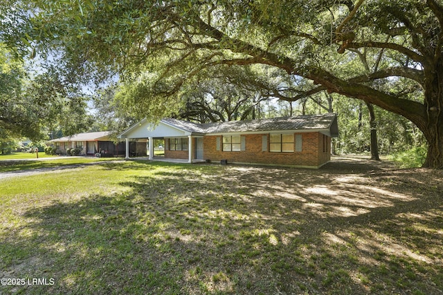 96 Pine Forest Loop, Ridgeland, SC 29936 - ranch-style home featuring a front lawn and brick siding