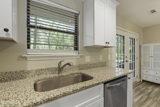 96 Pine Forest Loop, Ridgeland, SC 29936 - kitchen with dishwasher, a sink, white cabinets, french doors, and wood finished floors