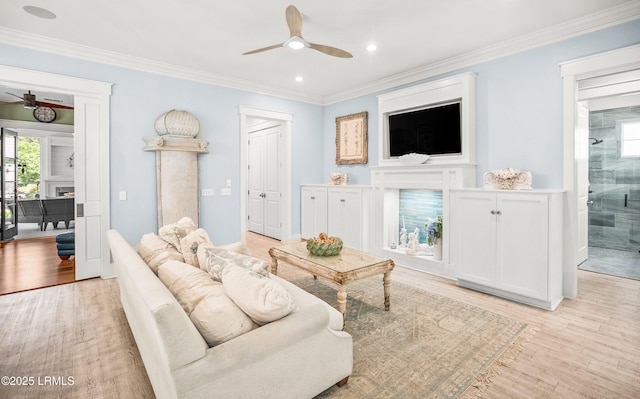3 Veridian Park E, Beaufort, SC 29907 - living room featuring ceiling fan, crown molding, light wood-type flooring, a fireplace, and recessed lighting