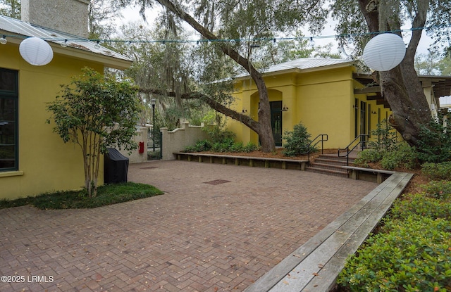 3 Veridian Park E, Beaufort, SC 29907 - view of side of home with stucco siding and metal roof