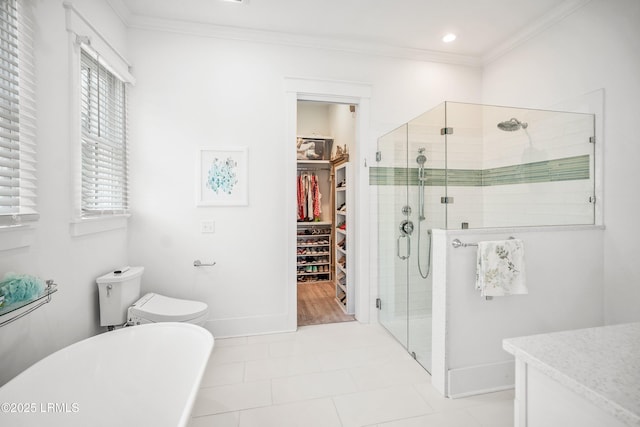 3 Veridian Park E, Beaufort, SC 29907 - bathroom with a spacious closet, a shower stall, a freestanding tub, vanity, and ornamental molding