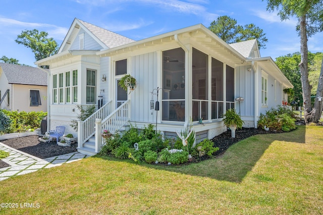 3 Veridian Park E, Beaufort, SC 29907 - view of front facade with board and batten siding, roof with shingles, and a front lawn