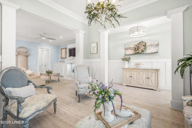 3 Veridian Park E, Beaufort, SC 29907 - living area with ornate columns, ornamental molding, wood finished floors, a ceiling fan, and a chandelier