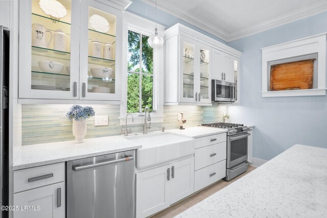 3 Veridian Park E, Beaufort, SC 29907 - kitchen featuring appliances with stainless steel finishes, a sink, tasteful backsplash, light stone counters, and white cabinets