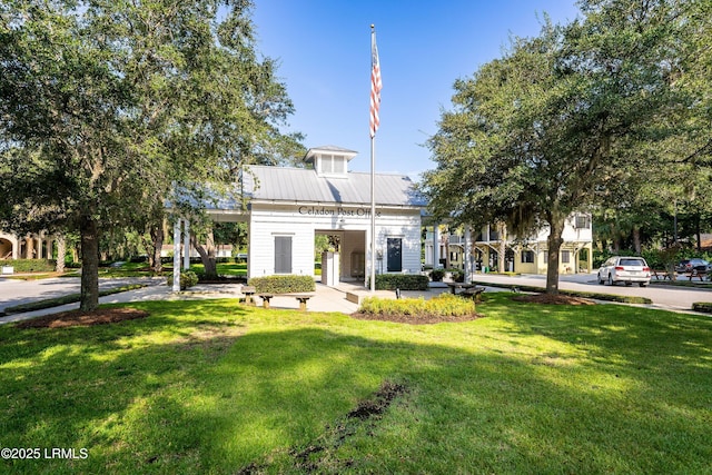 3 Veridian Park E, Beaufort, SC 29907 - rear view of house with a yard and metal roof