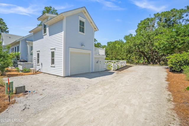 3 Veridian Park E, Beaufort, SC 29907 - view of side of property featuring dirt driveway and a garage