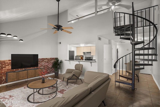 900 Brotherhood Rd Unit J6, Beaufort, SC 29902 - living room with a towering ceiling, dark tile patterned floors, stairs, and ceiling fan