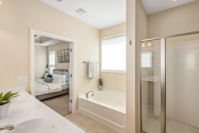 ensuite bathroom with a bath, a stall shower, ensuite bathroom, and visible vents