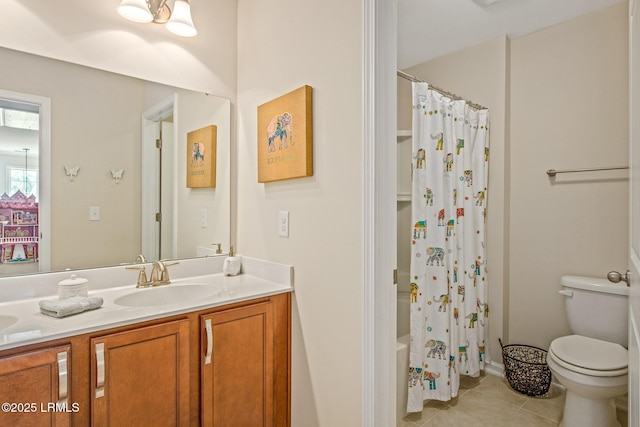bathroom with toilet, shower / bath combo with shower curtain, tile patterned flooring, and vanity