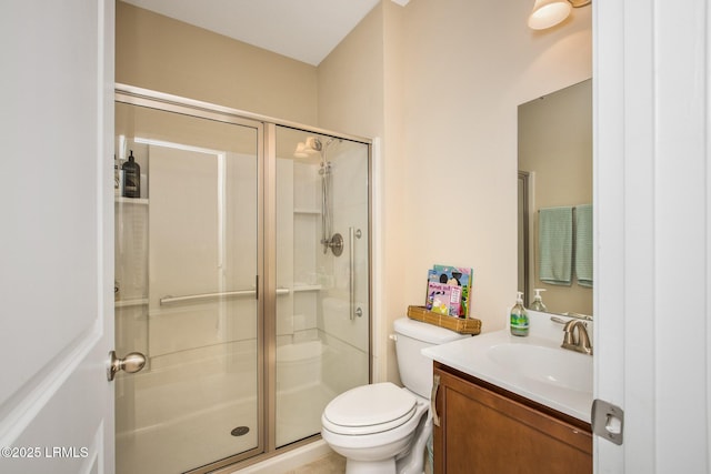 full bathroom with toilet, a stall shower, and vanity