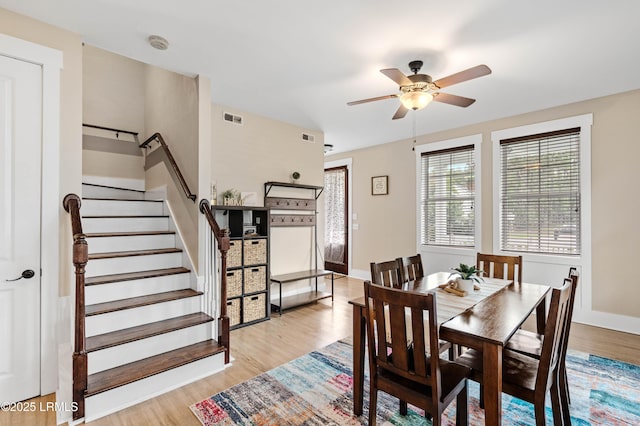 35 Sommer Lake Dr, Beaufort, SC 29902 - dining room with a ceiling fan, visible vents, light wood-style flooring, and stairway