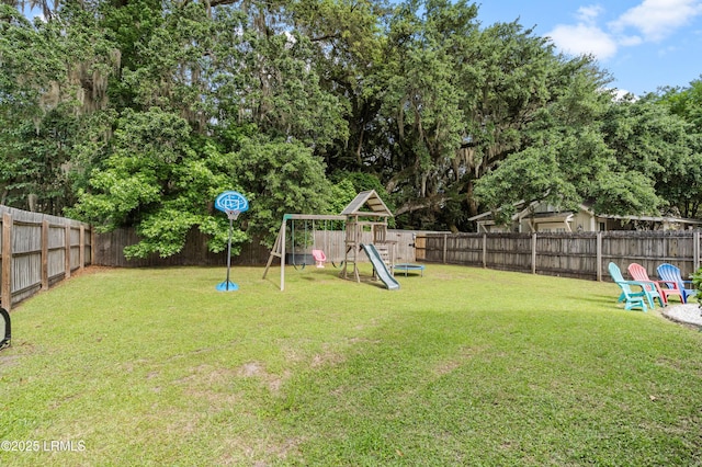 35 Sommer Lake Dr, Beaufort, SC 29902 - view of yard with a playground and a fenced backyard