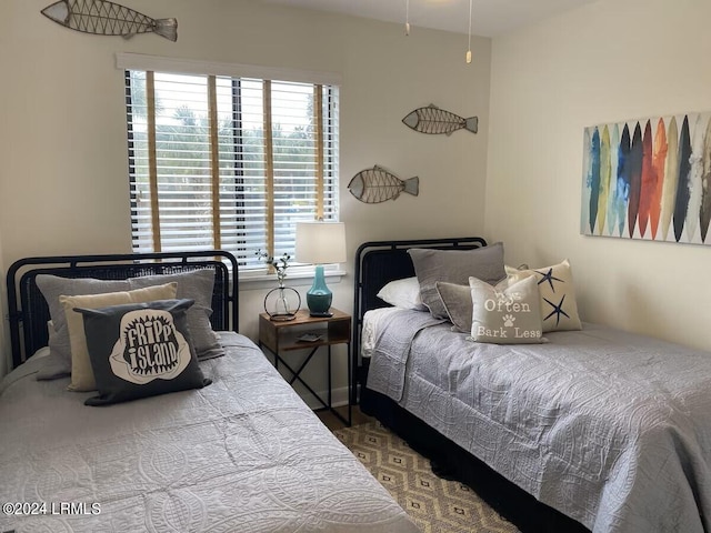 bedroom featuring multiple windows