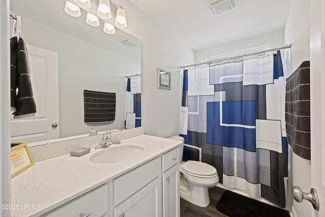 69 Garden Gate Ln, Hardeeville, SC 29927 - full bathroom featuring toilet, vanity, wood finished floors, and curtained shower