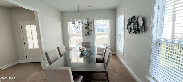 1272 Windswept Oak Ln, Beaufort, SC 29902 - dining space with wood-type flooring and a notable chandelier