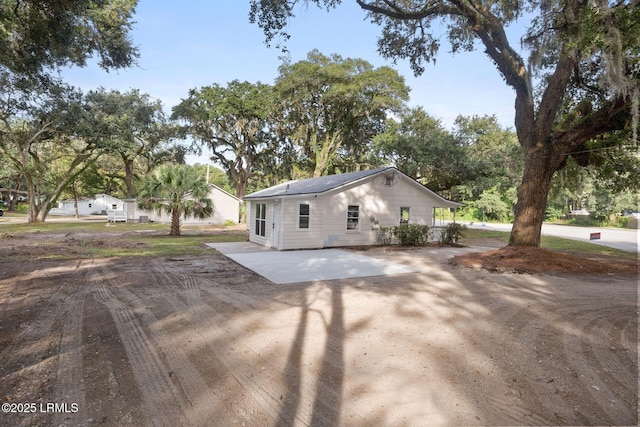 exterior space featuring dirt driveway