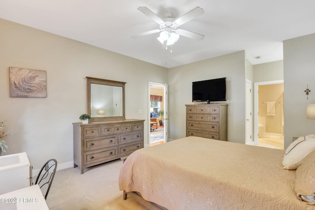 carpeted bedroom with ceiling fan and ensuite bathroom