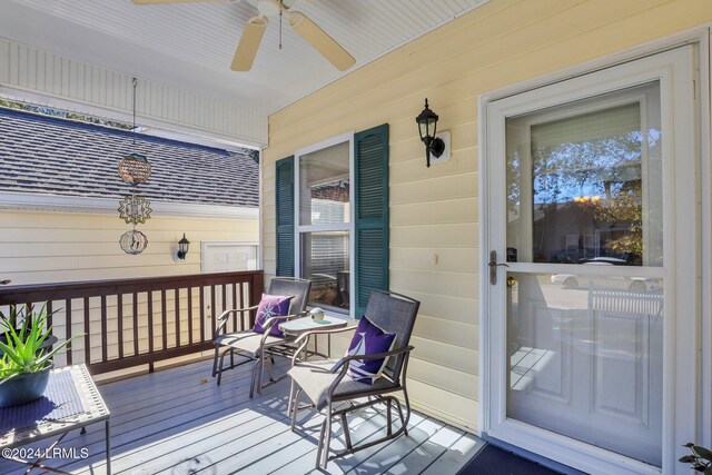 deck featuring a porch and ceiling fan