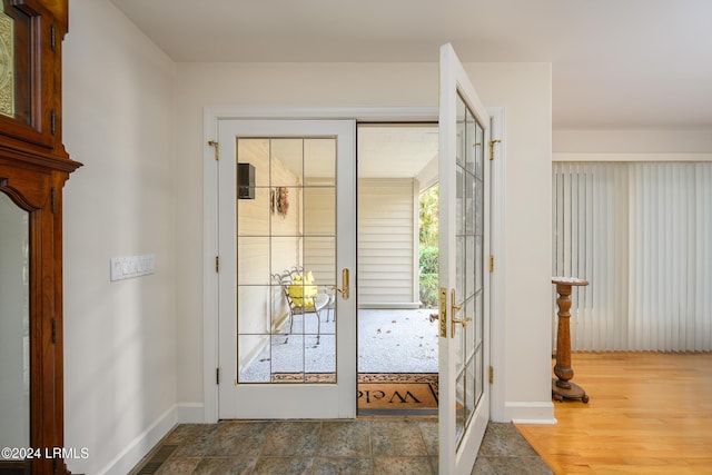 doorway featuring hardwood / wood-style flooring and french doors