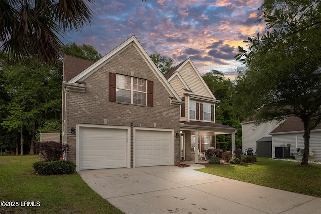 482 Live Oak Walk, Bluffton, SC 29910 - traditional-style house featuring a garage, cooling unit, brick siding, concrete driveway, and a lawn
