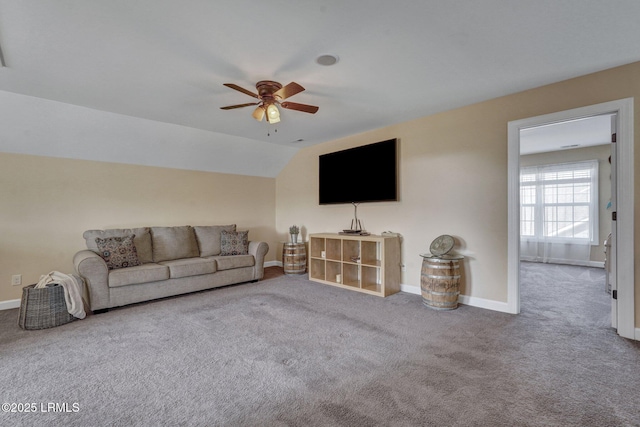 unfurnished living room featuring baseboards, carpet floors, and ceiling fan