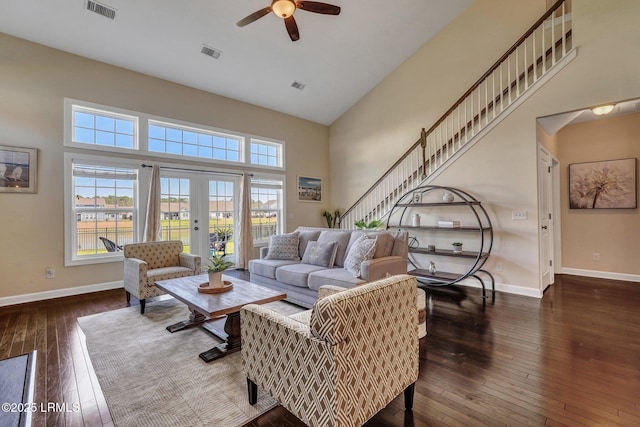 living room featuring a ceiling fan, hardwood / wood-style flooring, baseboards, and visible vents