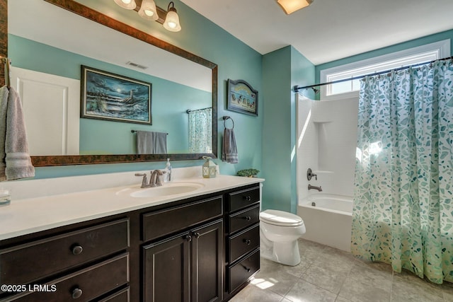 full bathroom with tile patterned floors, visible vents, shower / bath combo with shower curtain, toilet, and vanity