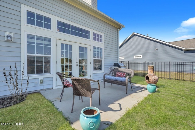 view of patio / terrace with french doors and fence