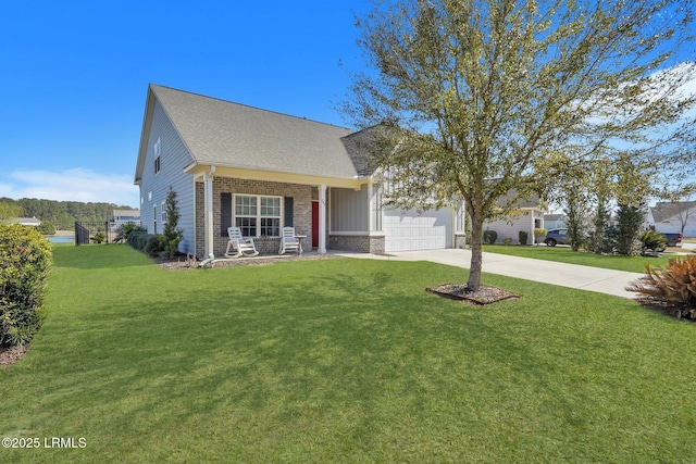 view of front of house featuring brick siding, driveway, an attached garage, and a front yard