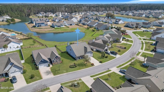 bird's eye view featuring a residential view and a water view