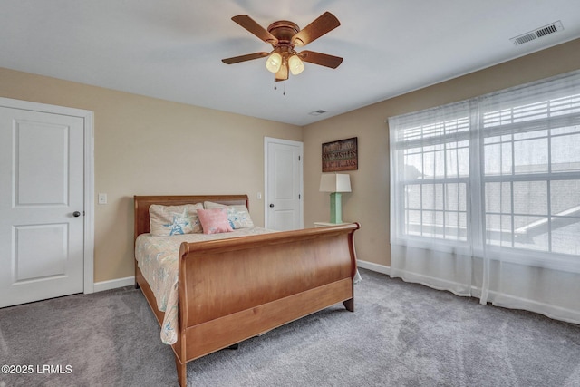 bedroom featuring visible vents, ceiling fan, baseboards, and carpet floors