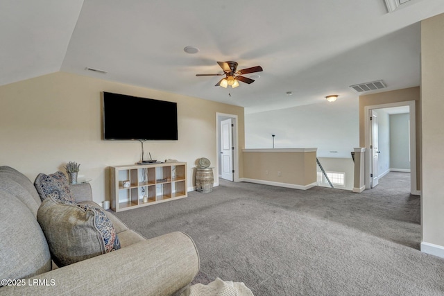 carpeted living area featuring visible vents, baseboards, lofted ceiling, and ceiling fan