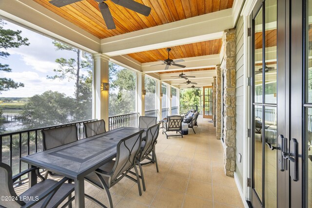 sunroom with wooden ceiling and beamed ceiling