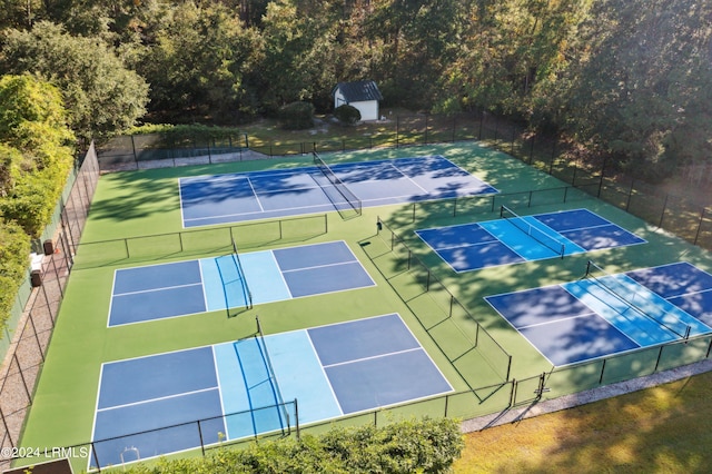 view of sport court featuring fence