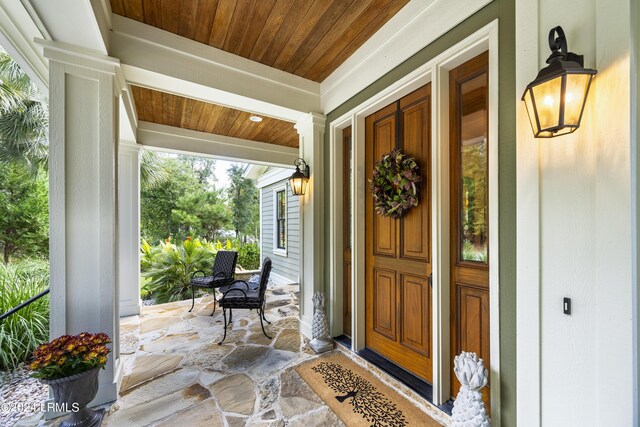 property entrance with covered porch