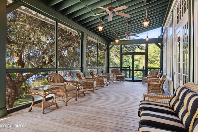 sunroom featuring a ceiling fan