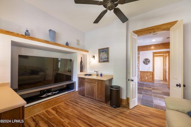 living room with ceiling fan and wood finished floors