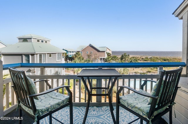 balcony featuring a water view