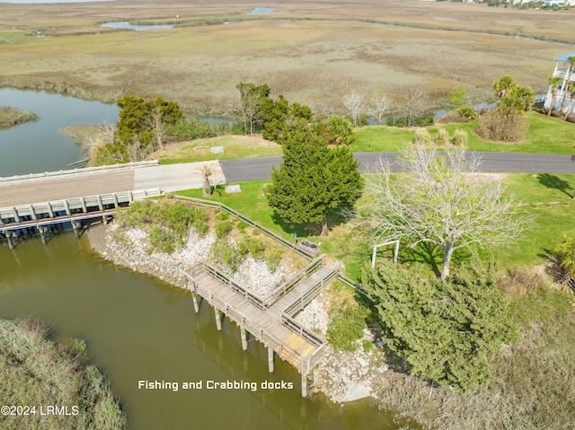 birds eye view of property with a water view and a rural view