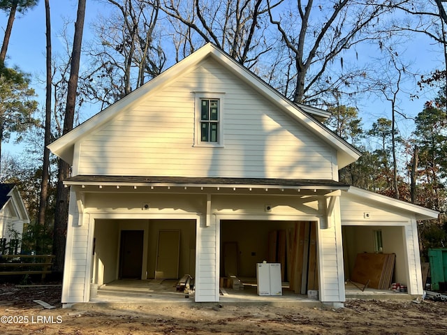 back of house with a garage