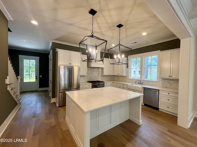 14 Heron Pt, Okatie, SC 29909 - kitchen with high quality appliances, ornamental molding, a center island, dark wood finished floors, and a chandelier